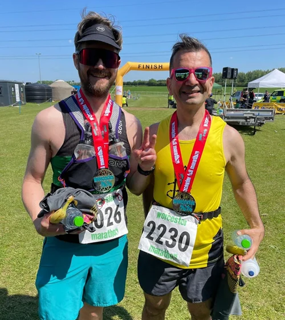 Run Squad athletes celebrating after finishing a marathon