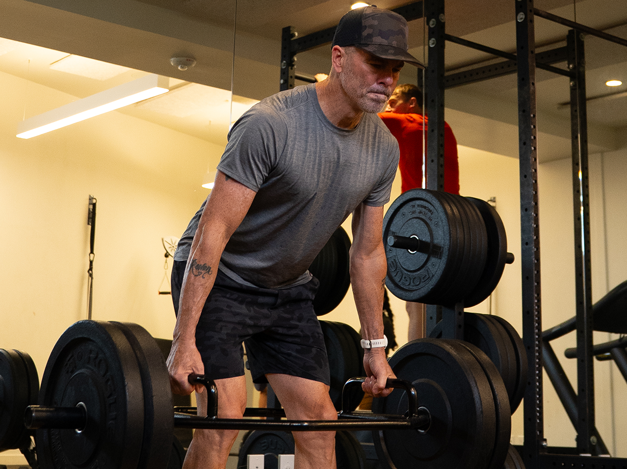 Athlete performing a trap-bar deadlift in the gym