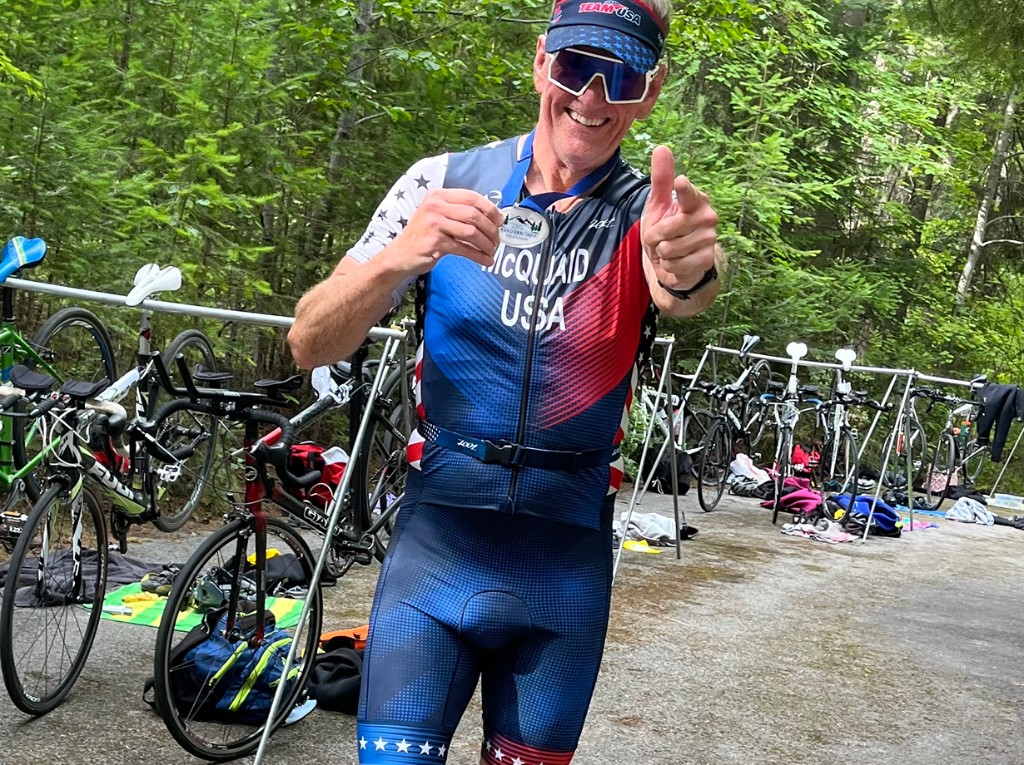 Team USA athlete celebrating with a finisher medal