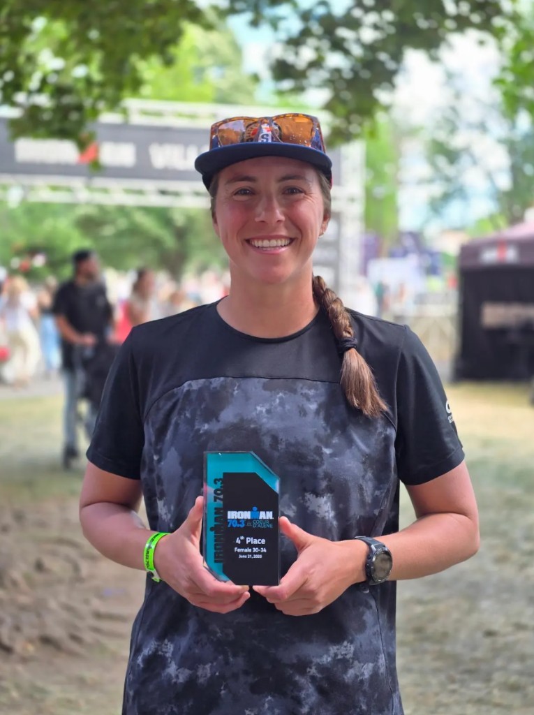 Kat Klass with her IRONMAN 70.3 Coeur D'Alene trophy