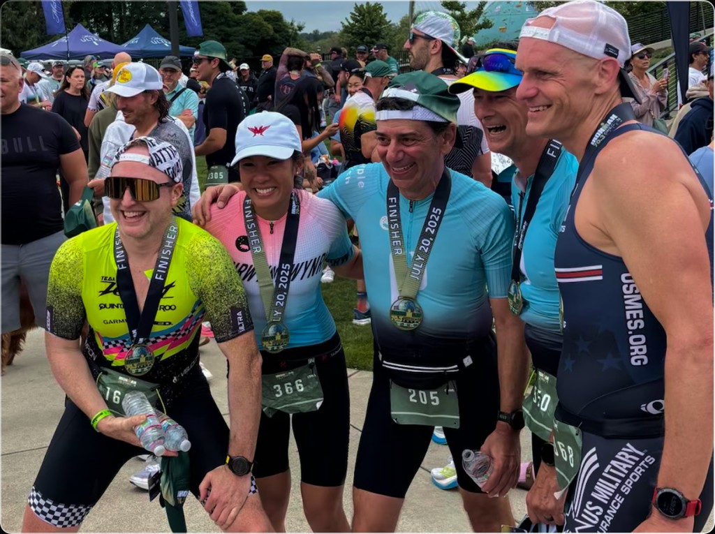 Tri Squad athletes celebrating together after race day